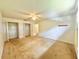 Bedroom featuring ceiling fan, closets, and a connecting doorway to another room at 1844 Emily Dr, Winter Haven, FL 33884