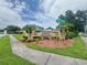Entrance to the Emily Estates community with beautiful landscaping and signage at 1844 Emily Dr, Winter Haven, FL 33884