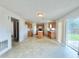 Eat-in kitchen features ample counter space, wooden cabinets and sliding glass doors at 1844 Emily Dr, Winter Haven, FL 33884