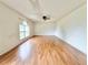 Expansive living room featuring laminate flooring and a large window at 1844 Emily Dr, Winter Haven, FL 33884