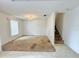 Bright living room area with staircase and chandelier at 1844 Emily Dr, Winter Haven, FL 33884