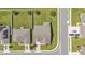 Overhead view of a single-Gathering home featuring a well-manicured lawn, and a convenient two-car garage at 195 Kissengen Park Blvd, Bartow, FL 33830