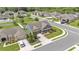Aerial view of a single-Gathering home situated on a corner lot with mature trees and lush green lawns at 195 Kissengen Park Blvd, Bartow, FL 33830