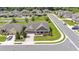 Aerial view of a single-Gathering home on a corner lot with mature trees and well-maintained landscaping at 195 Kissengen Park Blvd, Bartow, FL 33830