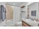 Neutral bathroom featuring a shower/tub combo, a decorative shelf, and a single sink vanity at 195 Kissengen Park Blvd, Bartow, FL 33830