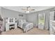 Bright bedroom featuring a large window, a desk, and ample closet space at 195 Kissengen Park Blvd, Bartow, FL 33830