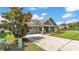 Charming single-Gathering home featuring a two-car garage, beautiful landscaping, and a well-manicured lawn at 195 Kissengen Park Blvd, Bartow, FL 33830