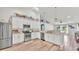Bright kitchen with stainless steel appliances, white cabinets, and hardwood floors at 195 Kissengen Park Blvd, Bartow, FL 33830
