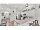 Well-lit kitchen with breakfast bar, modern appliances, and cozy breakfast bar at 195 Kissengen Park Blvd, Bartow, FL 33830
