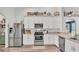Modern kitchen featuring stainless steel appliances, white cabinetry, and stylish countertops at 195 Kissengen Park Blvd, Bartow, FL 33830