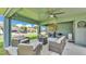 Relaxing outdoor patio includes a gas grill, fire pit, and comfortable seating area at 195 Kissengen Park Blvd, Bartow, FL 33830