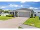 Attractive home with well-kept lawn, gray siding and a two car garage at 1976 Harvest Landing Cir, Lakeland, FL 33810