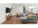 Open-concept living area with modern decor, lots of natural light and cozy sectional at 1976 Harvest Landing Cir, Lakeland, FL 33810