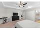 A view of the primary bedroom boasting ample space and a smooth transition to the ensuite bathroom at 1976 Harvest Landing Cir, Lakeland, FL 33810