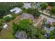 Overhead shot of a residential property highlighting the yard, neighboring homes, and street access at 208 Lake Dale Dr, Auburndale, FL 33823