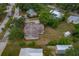 Bird's eye view of a residential property displaying its roof, landscape, and location within the community at 208 Lake Dale Dr, Auburndale, FL 33823