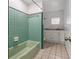 Bathroom featuring a green tiled shower and white vanity at 208 Lake Dale Dr, Auburndale, FL 33823