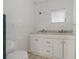 Bathroom with a double sink vanity and tile floor at 208 Lake Dale Dr, Auburndale, FL 33823
