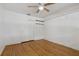 Bright bedroom featuring hardwood floors, closet space, and neutral paint, offering a versatile canvas at 208 Lake Dale Dr, Auburndale, FL 33823