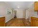 Open dining area with hardwood floors, neutral paint, and seamless flow to other rooms at 208 Lake Dale Dr, Auburndale, FL 33823