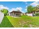 Expansive backyard boasts a large yard with a covered structure and storage shed at 216 Pike St, Auburndale, FL 33823