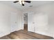 Bedroom with wood-look flooring and a closet, offering ample storage space at 216 Pike St, Auburndale, FL 33823