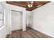 Bright bedroom featuring wood-look floors, a closet and a wood ceiling at 216 Pike St, Auburndale, FL 33823