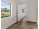 Bedroom featuring wood-look floors and two windows at 216 Pike St, Auburndale, FL 33823