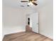 Bedroom featuring wood-look floors and bright interior with ample natural light at 216 Pike St, Auburndale, FL 33823