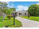 Charming single-story home with a carport and landscaping at 216 Pike St, Auburndale, FL 33823