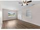Bright living room featuring wood-look flooring and lots of natural light at 216 Pike St, Auburndale, FL 33823