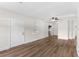 Spacious living room featuring modern vinyl flooring and a ceiling fan at 216 Pike St, Auburndale, FL 33823
