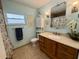 Charming bathroom with beach-themed decor and tiled floors at 217 Shore Loop, Winter Haven, FL 33884