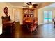 Dining room with hardwood floors and access to screened-in outdoor living area and pool at 217 Shore Loop, Winter Haven, FL 33884