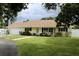Charming one-story home with well-maintained lawn, landscaping, and a two car garage at 217 Shore Loop, Winter Haven, FL 33884