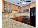 Updated kitchen featuring granite countertops, stainless steel appliances, and tile backsplash at 217 Shore Loop, Winter Haven, FL 33884