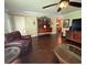 Spacious living room with hardwood floors, comfortable seating, and large windows at 217 Shore Loop, Winter Haven, FL 33884