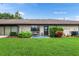 Well-maintained backyard featuring a lawn, patio, and garden space at 2282 Firestone Pl, Winter Haven, FL 33884