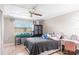 Bright bedroom featuring neutral walls, a ceiling fan, and a view to the backyard at 2282 Firestone Pl, Winter Haven, FL 33884