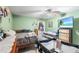 Bright bedroom featuring a ceiling fan, television, and Bedroom furniture, perfect for a Gathering at 2282 Firestone Pl, Winter Haven, FL 33884