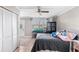 Light-filled bedroom boasting a ceiling fan, and a large window overlooking the yard at 2282 Firestone Pl, Winter Haven, FL 33884