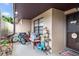 Cozy outdoor patio area with seating, plants, and a welcome sign near the front door at 2282 Firestone Pl, Winter Haven, FL 33884