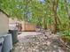 Fenced backyard with mature trees and a storage shed provides a private outdoor space at 2418 W 1St St, Sanford, FL 32771