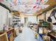 Unfinished basement with painted ceiling, storage racks, and open layout, ready for customization at 2418 W 1St St, Sanford, FL 32771