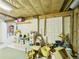 Unfinished basement with exposed insulation, offering flexible space for storage and customization at 2418 W 1St St, Sanford, FL 32771