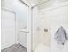 Shower space with glass doors beside the washing machine and dryer units at 2418 W 1St St, Sanford, FL 32771