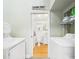 Full view of the bathroom from the laundry room with washing machines and dryers included at 2418 W 1St St, Sanford, FL 32771