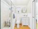 Bathroom with tiled shower, toilet, sink, and modern fixtures for a comfortable space at 2418 W 1St St, Sanford, FL 32771