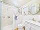 Bright bathroom with tiled shower, toilet, sink, and modern finishes for a clean aesthetic at 2418 W 1St St, Sanford, FL 32771