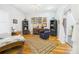 Bedroom featuring hardwood floors, chaise lounge, and natural light at 2418 W 1St St, Sanford, FL 32771